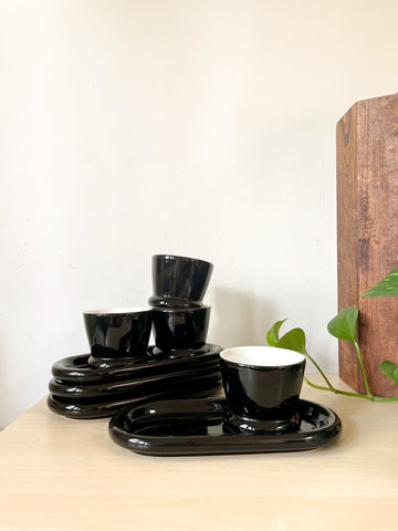 Set of Four - Black and white Handleless Teacup and Oblong Saucer Set