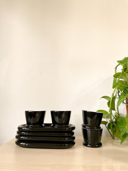 Set of Four - Black and white Handleless Teacup and Oblong Saucer Set